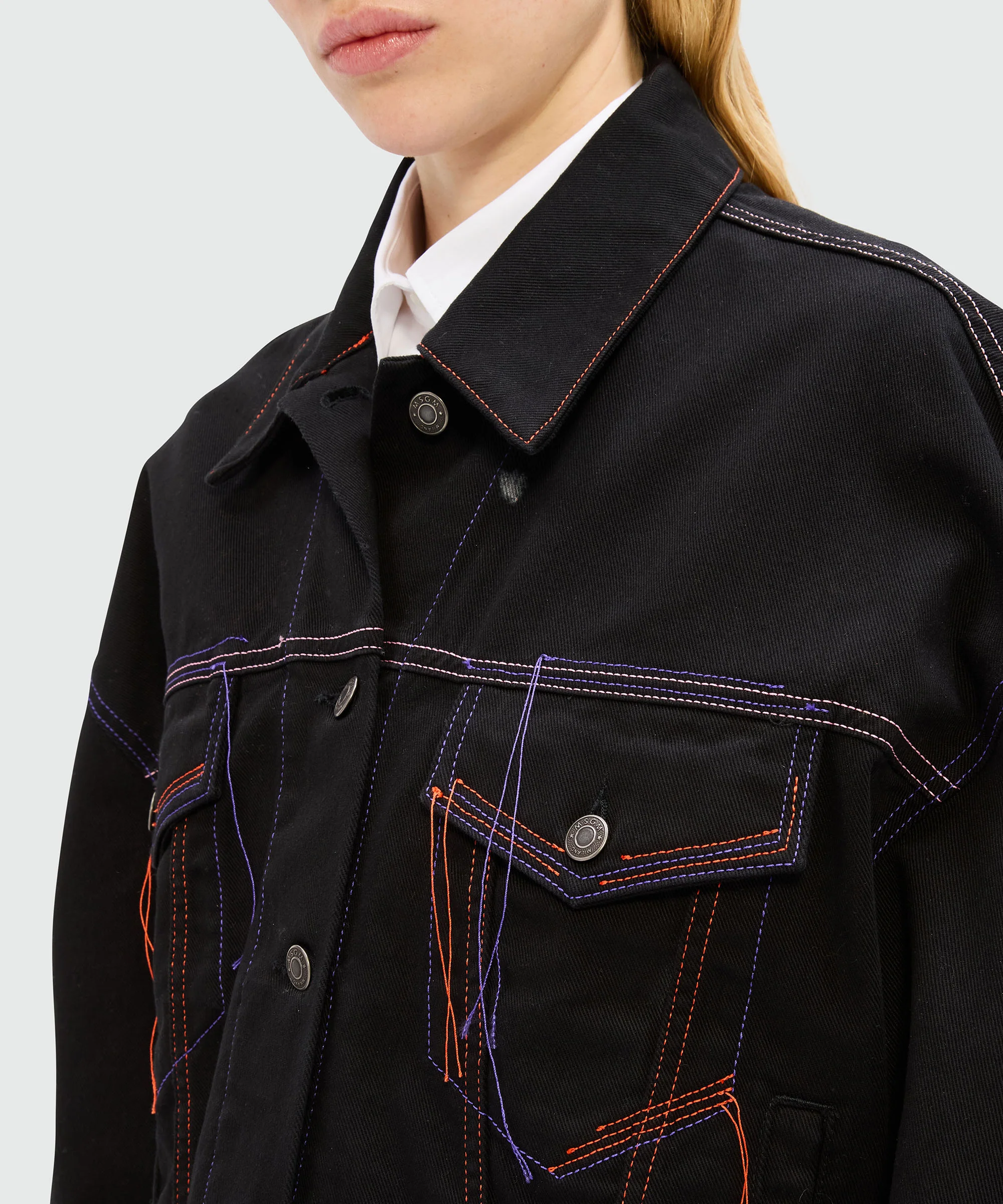 Black denim jacket with multi-colored stitching and threads - Image 5